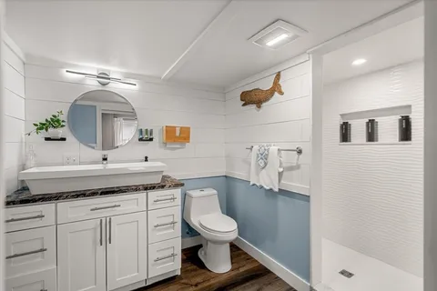a bathroom with a sink a mirror and bathtub
