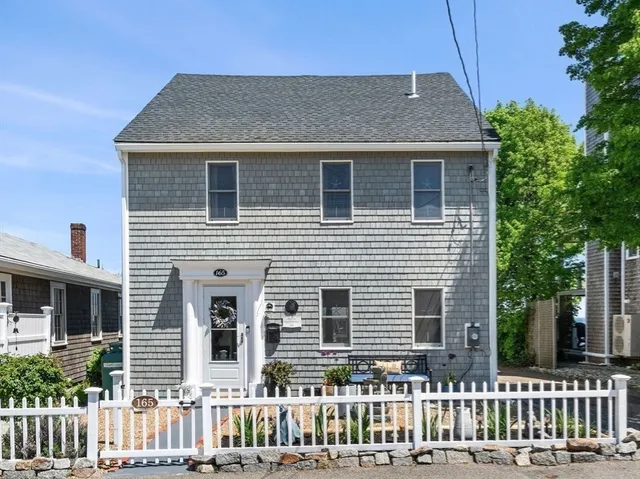 a front view of a house with a porch