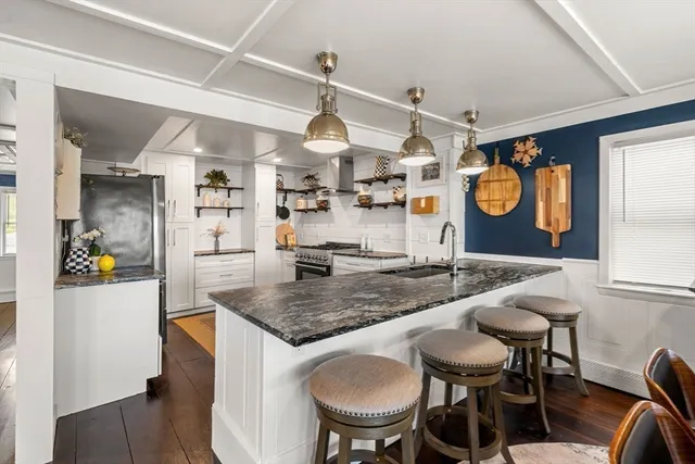 a kitchen with a table and chairs in it