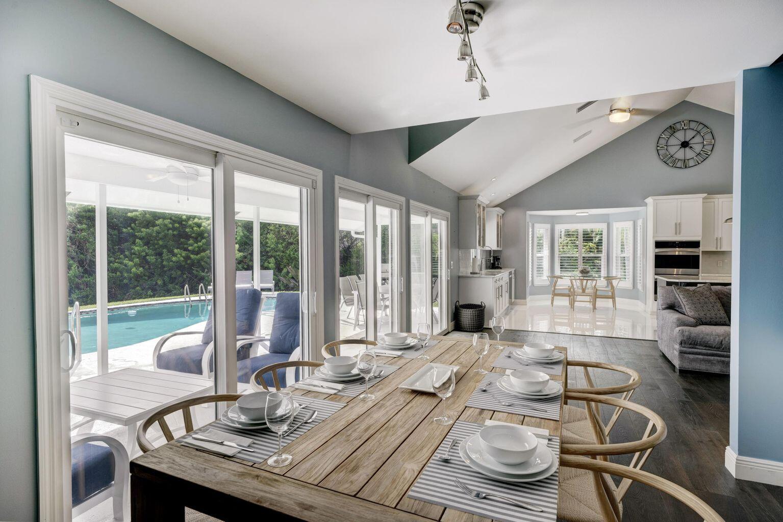 141 Pine Hill Trail West Tequesta, FL 33469 - Photo 12 of 53 a living room with furniture and large windows