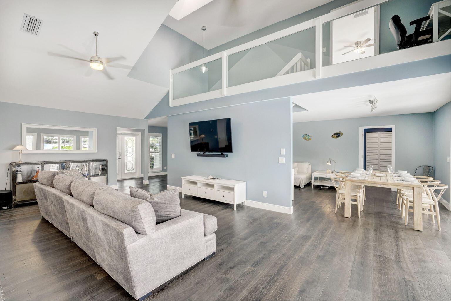 141 Pine Hill Trail West Tequesta, FL 33469 - Photo 14 of 53 a living room with furniture and a flat screen tv