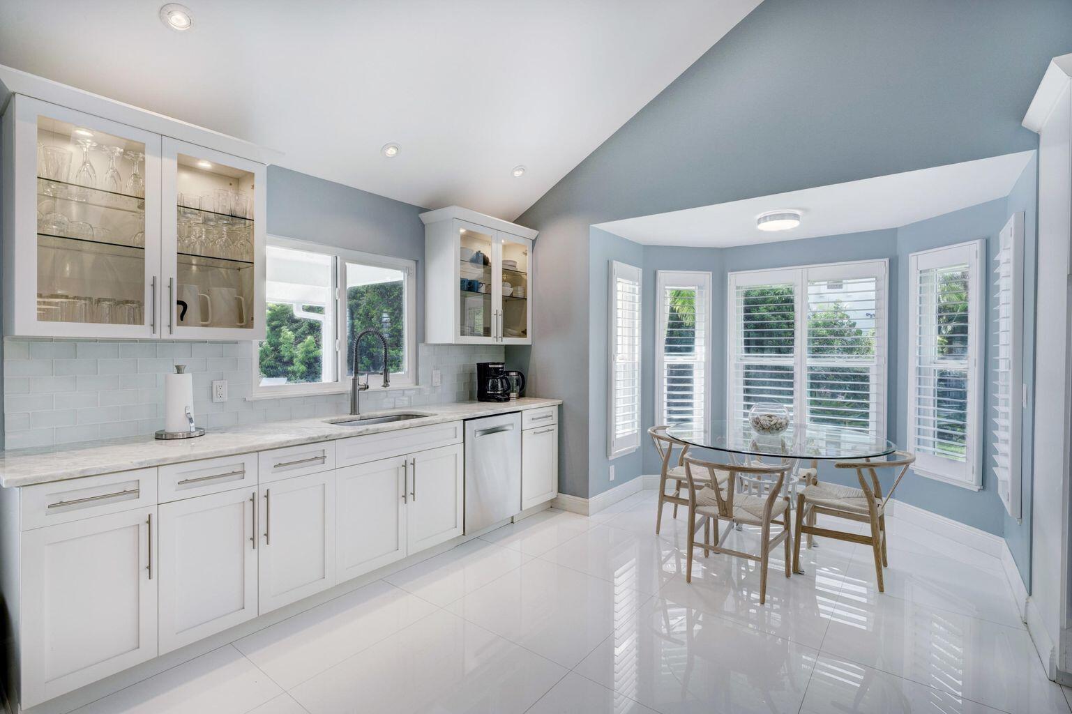 141 Pine Hill Trail West Tequesta, FL 33469 - Photo 17 of 53 a large white kitchen with a large window
