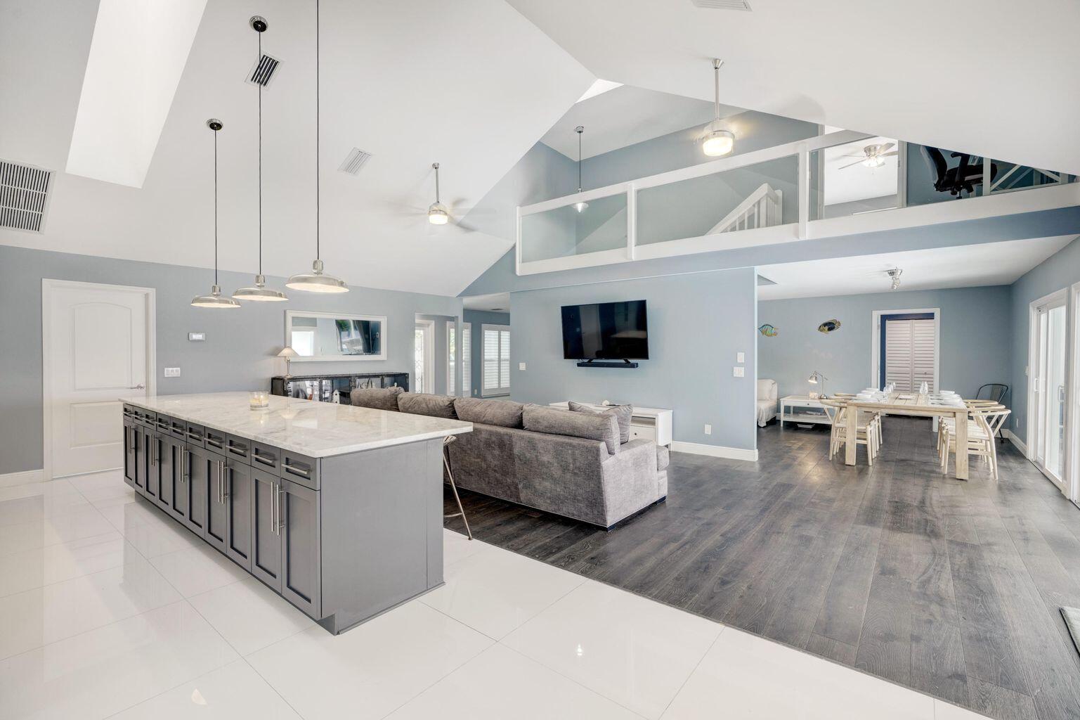 141 Pine Hill Trail West Tequesta, FL 33469 - Photo 21 of 53 a living room with furniture and wooden floor