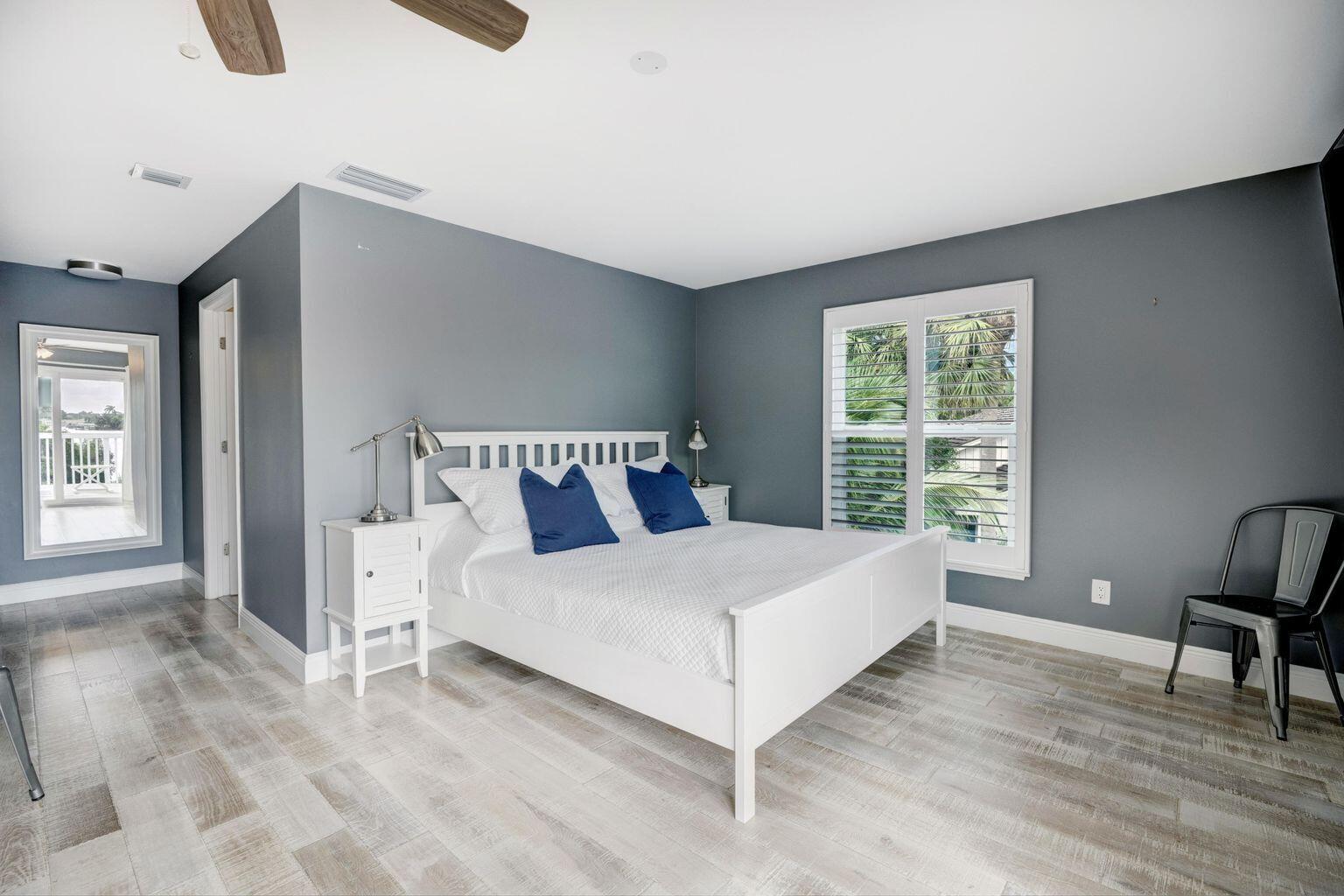 141 Pine Hill Trail West Tequesta, FL 33469 - Photo 25 of 53 a bedroom with a bed and a window