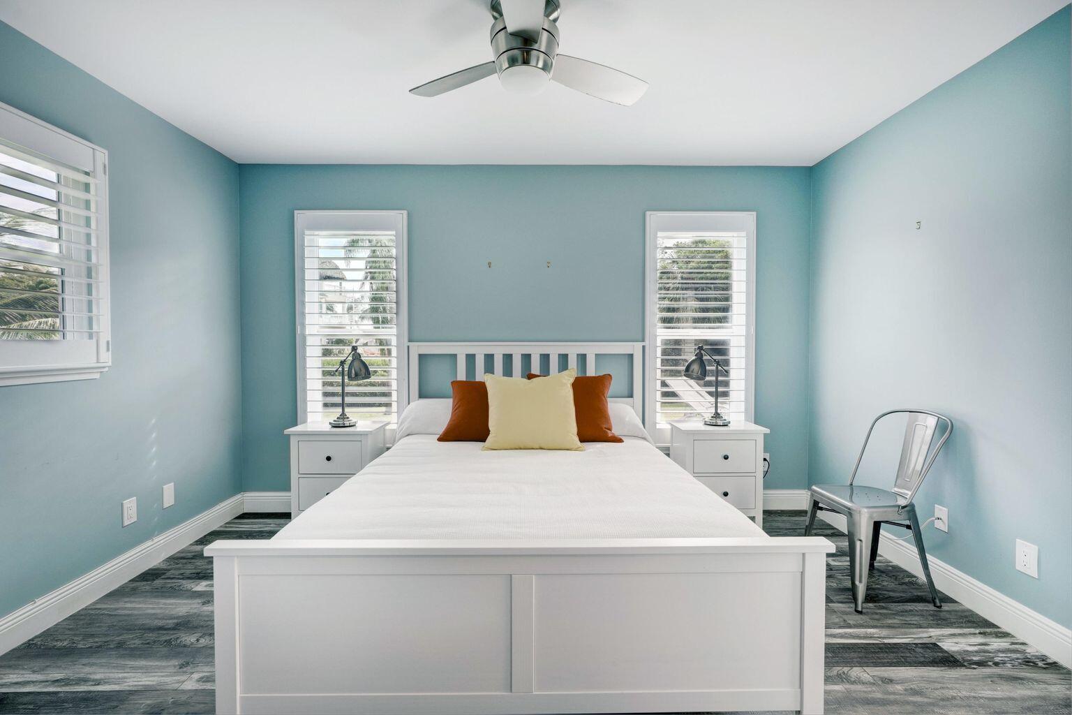 141 Pine Hill Trail West Tequesta, FL 33469 - Photo 33 of 53 a bed sitting in a bedroom next to a window