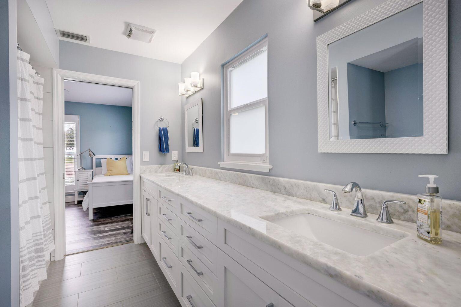 141 Pine Hill Trail West Tequesta, FL 33469 - Photo 40 of 53 a en suite bathroom with double sink and a mirror