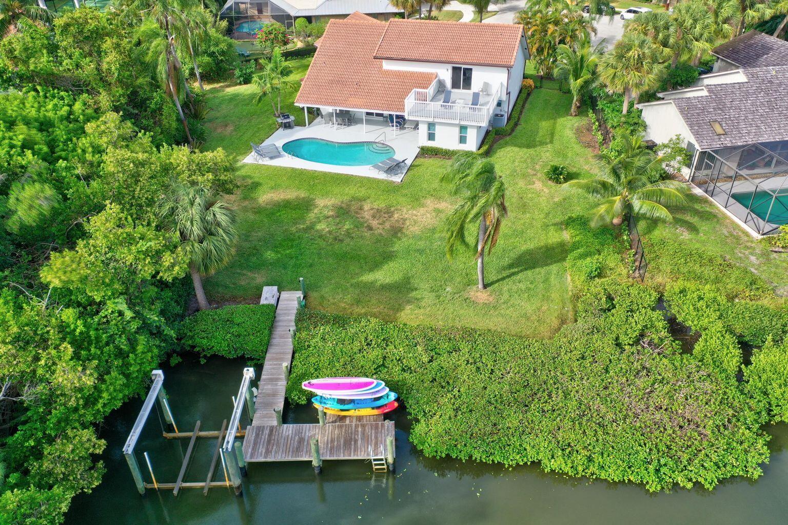 141 Pine Hill Trail West Tequesta, FL 33469 - Photo 4 of 53 an aerial view of a house with pool yard and outdoor seating