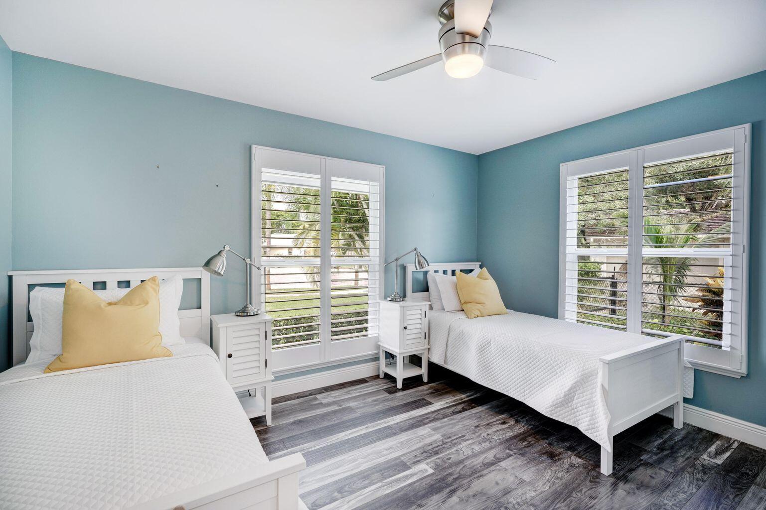 141 Pine Hill Trail West Tequesta, FL 33469 - Photo 41 of 53 a bedroom with a bed and wooden floor