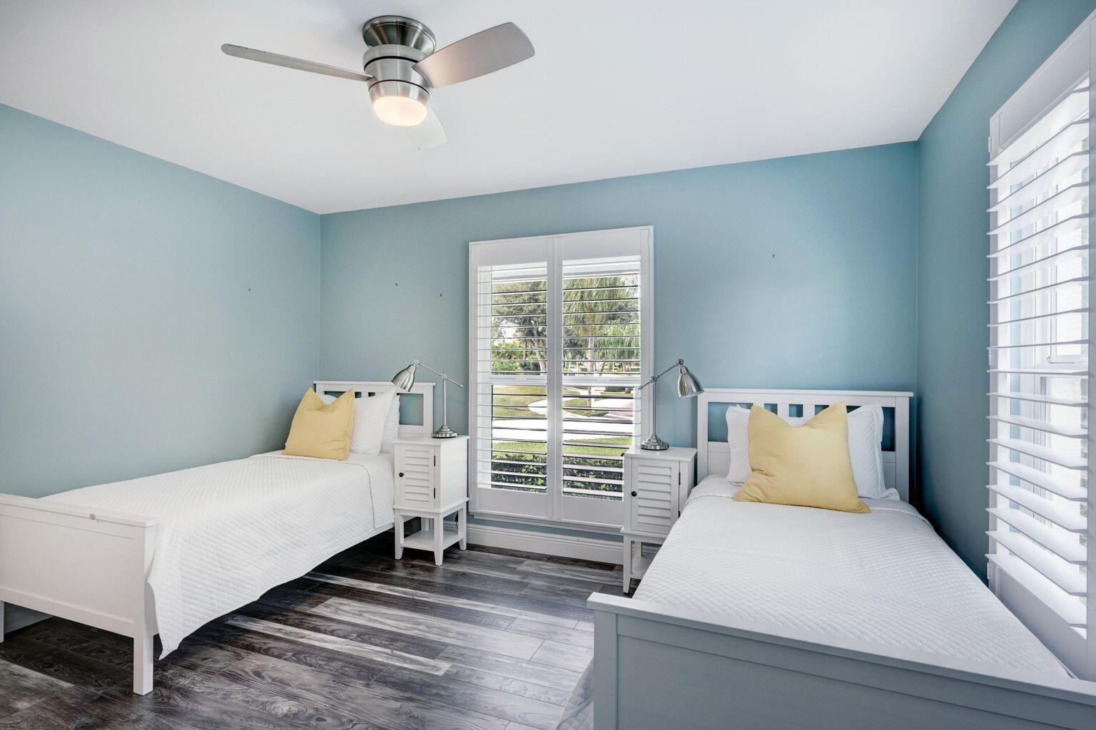 141 Pine Hill Trail West Tequesta, FL 33469 - Photo 42 of 53 a bedroom with a bed and window