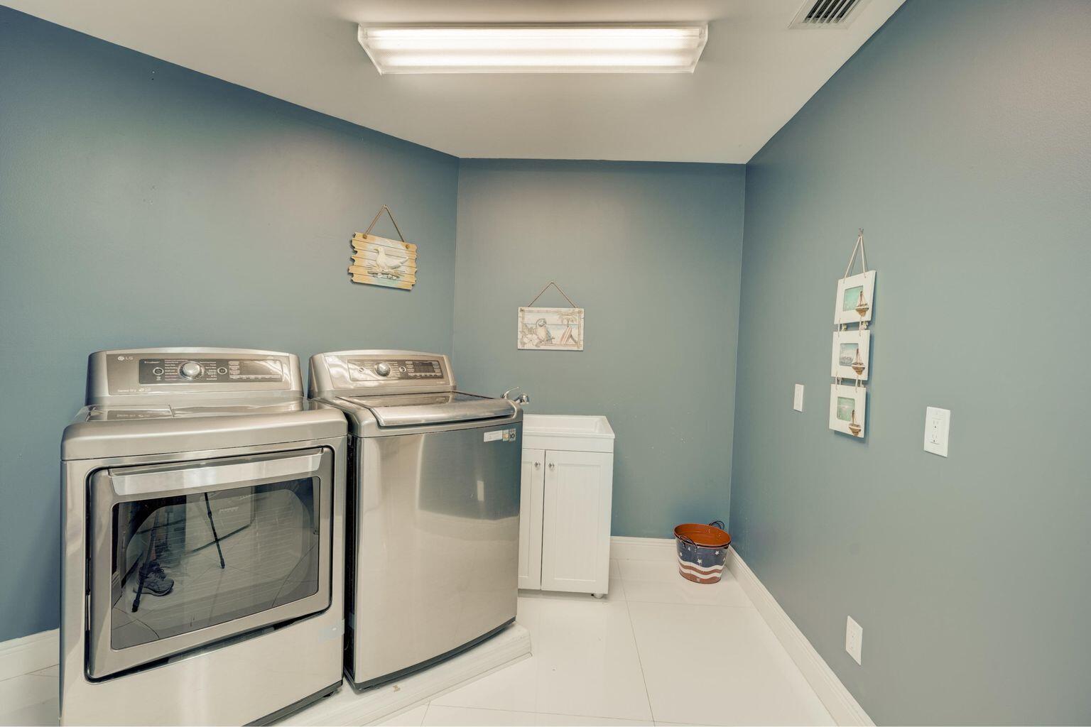 141 Pine Hill Trail West Tequesta, FL 33469 - Photo 49 of 53 a utility room with dryer and washer
