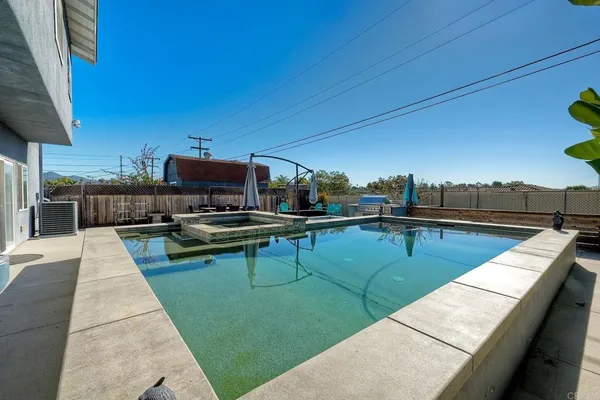 a view of a patio with chairs a barbeque grill and couches
