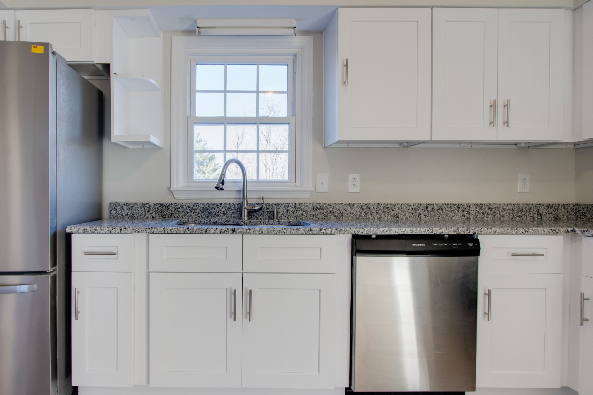 2005 Hunters Place Mount Juliet, TN 37122 - Photo 11 of 36 a kitchen with stainless steel appliances granite countertop white cabinets and window