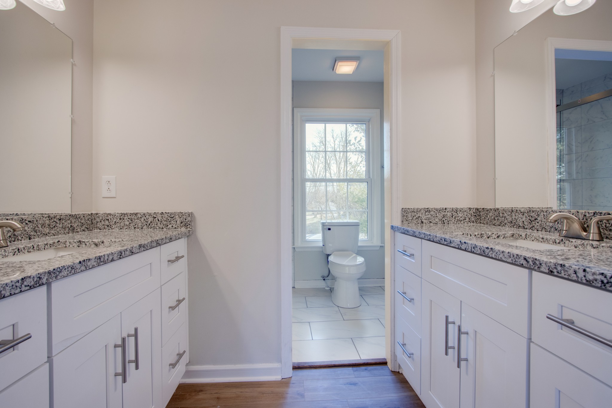2005 Hunters Place Mount Juliet, TN 37122 - Photo 19 of 36 a bathroom with a granite countertop sink and a toilet