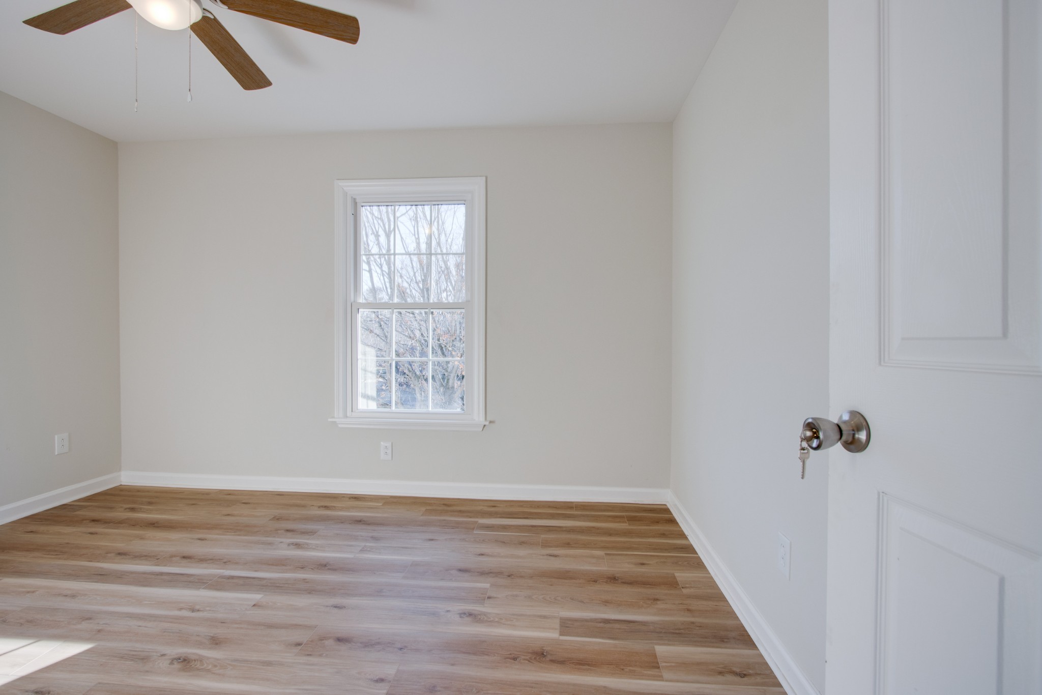 2005 Hunters Place Mount Juliet, TN 37122 - Photo 24 of 36 wooden floor in an empty room with a window