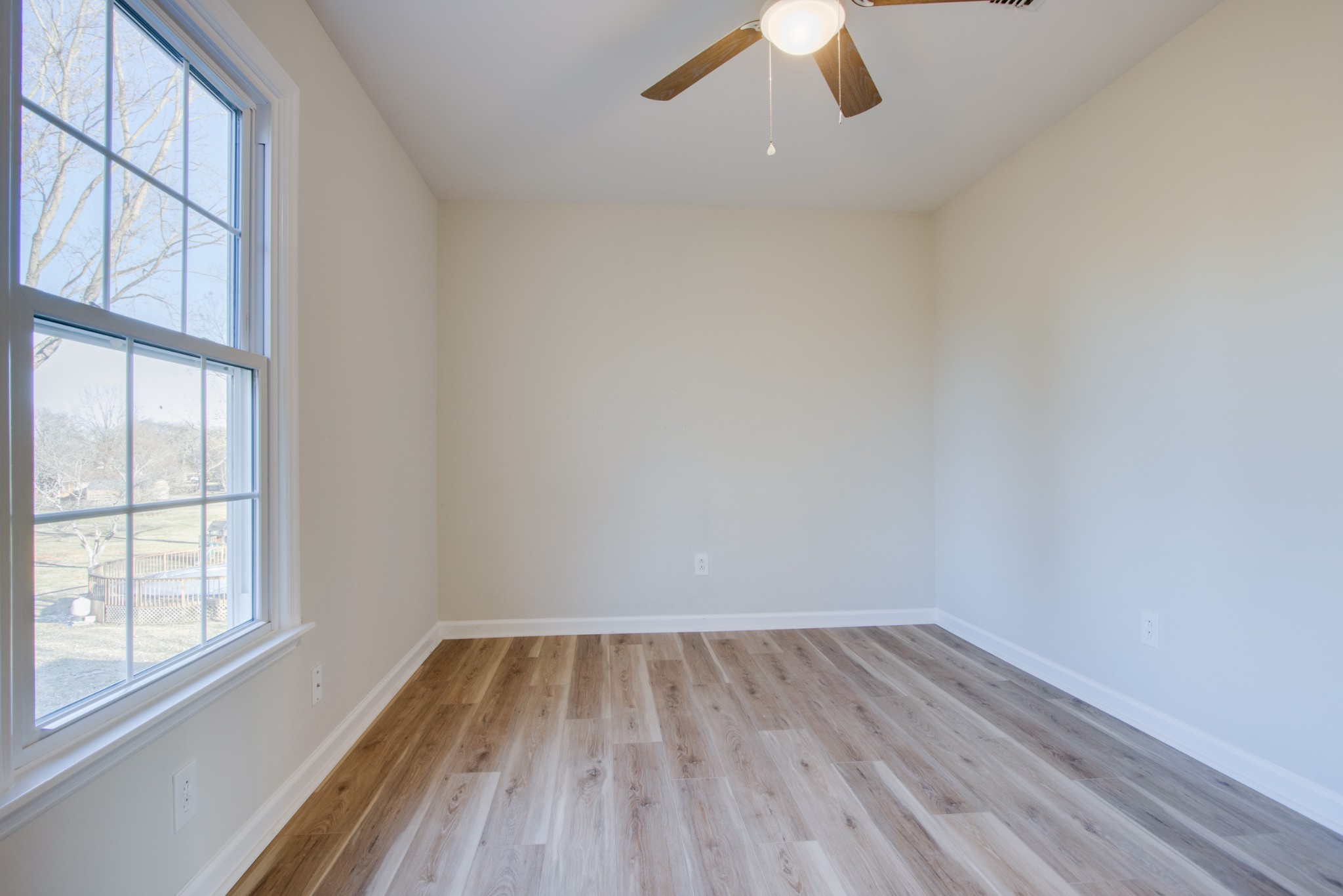 2005 Hunters Place Mount Juliet, TN 37122 - Photo 26 of 36 an empty room with a window and wooden floor