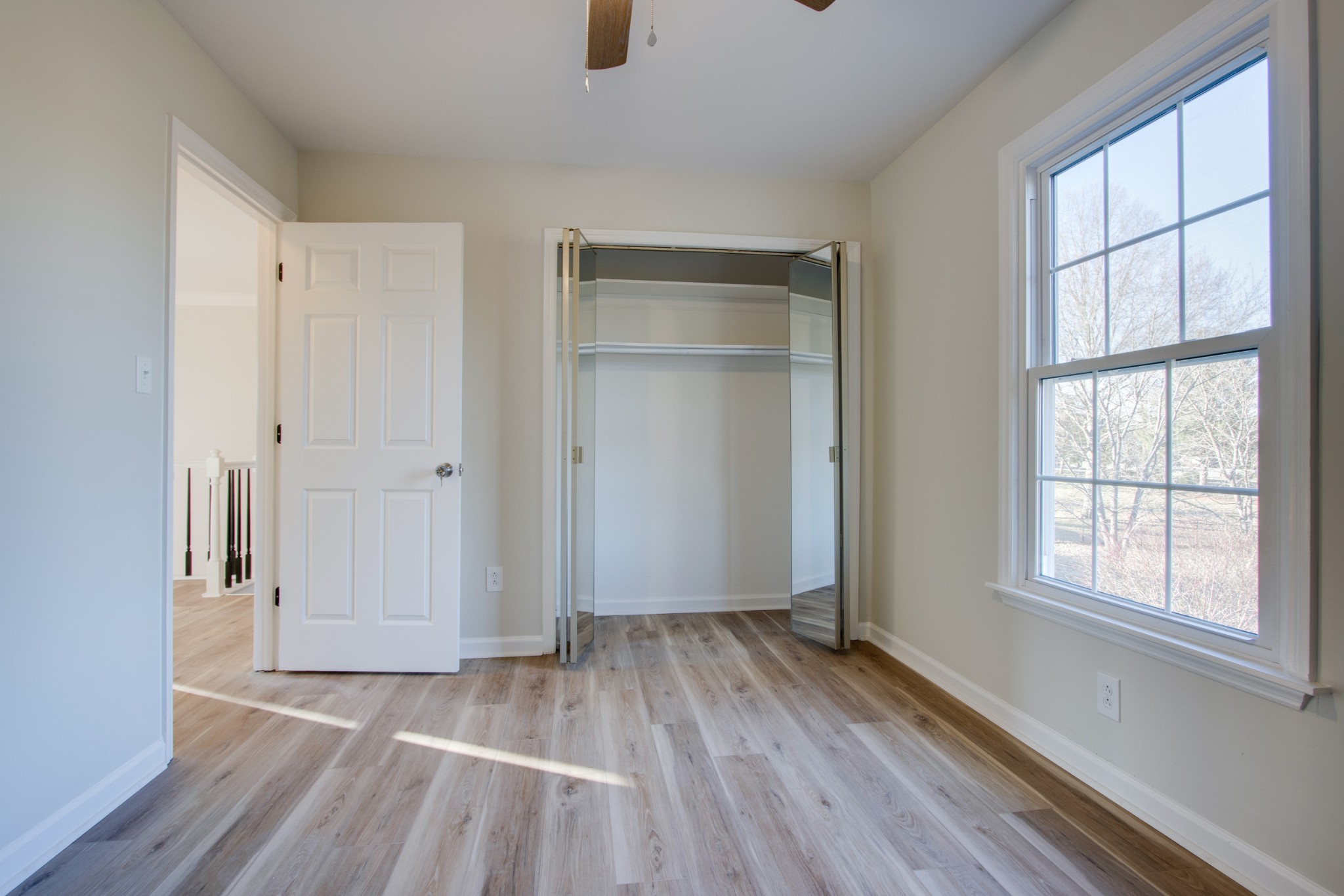 2005 Hunters Place Mount Juliet, TN 37122 - Photo 27 of 36 an empty room with wooden floor and windows