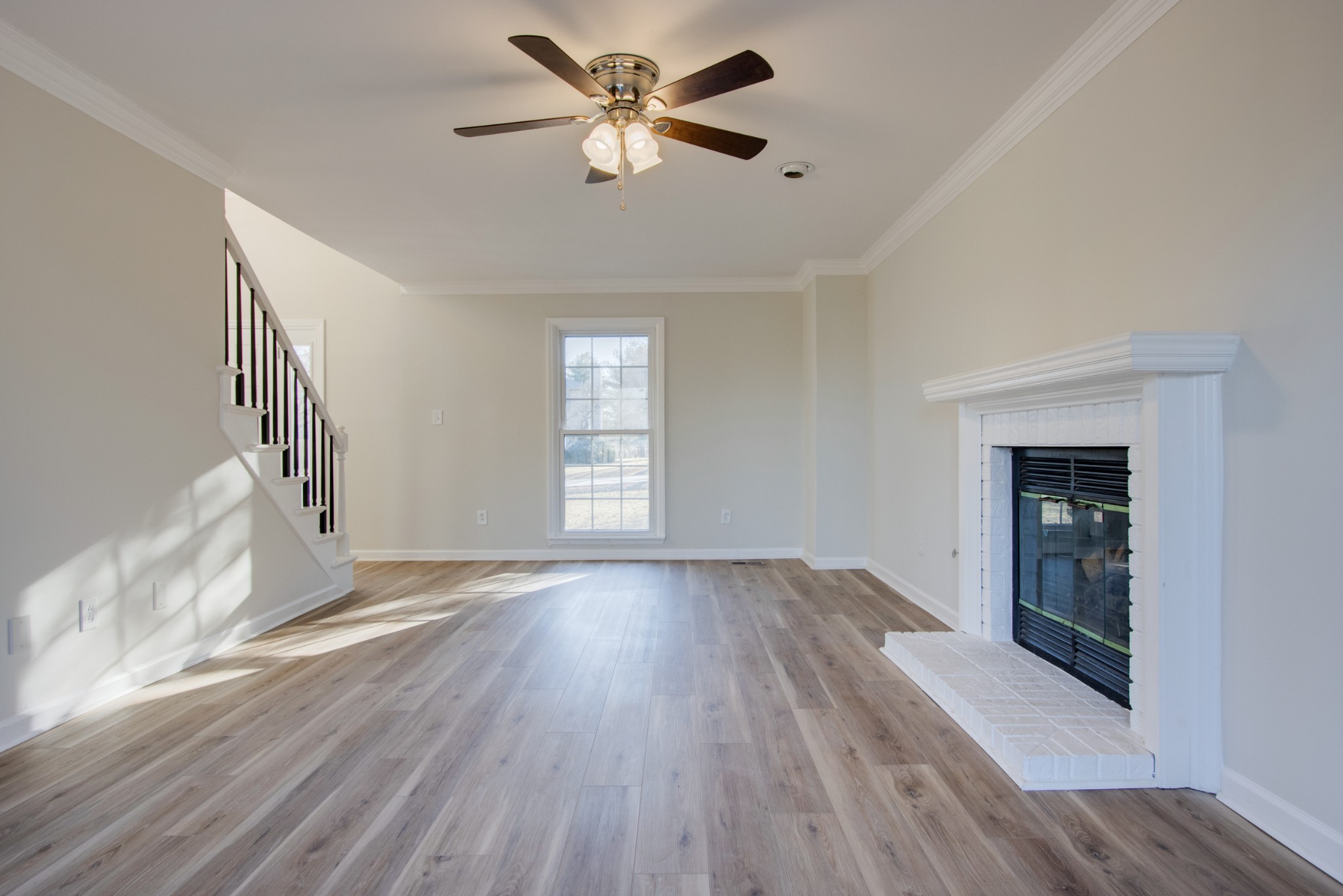 2005 Hunters Place Mount Juliet, TN 37122 - Photo 7 of 36 wooden floor in an empty room with a window