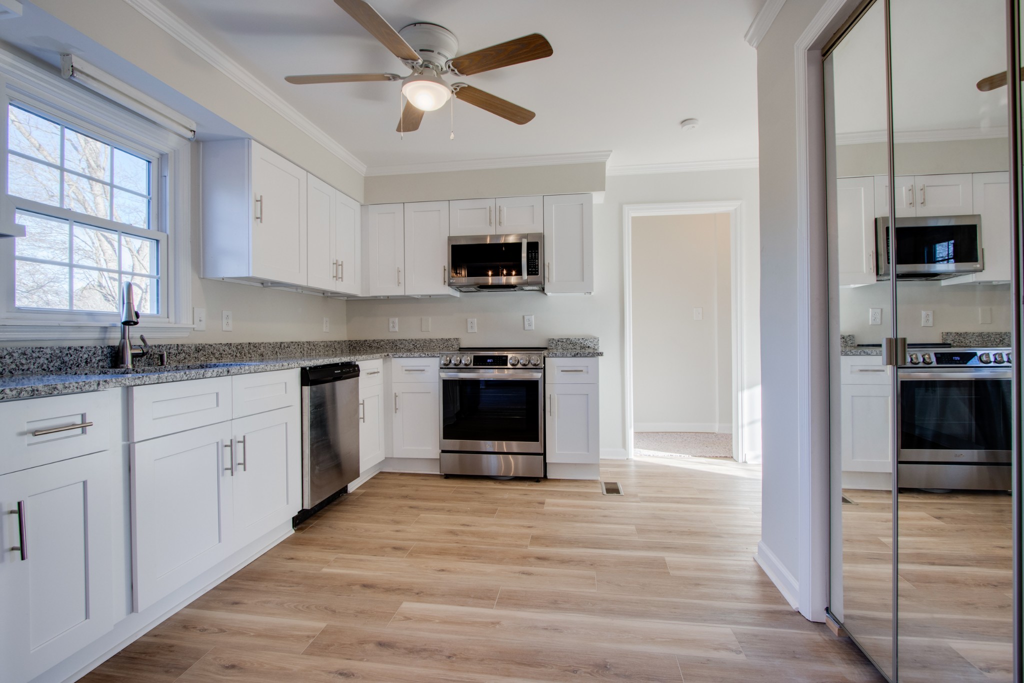 2005 Hunters Place Mount Juliet, TN 37122 - Photo 10 of 36 a kitchen with granite countertop a refrigerator and a stove