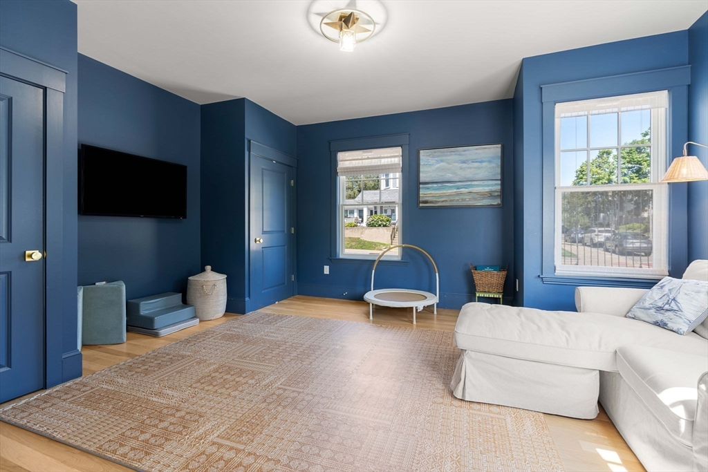 79 Lothrop Street Beverly, MA 01915 - Photo 18 of 42 a bedroom with furniture and a flat screen tv