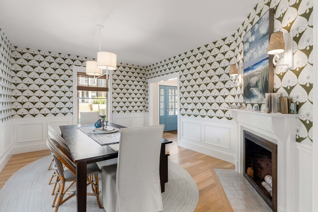 79 Lothrop Street Beverly, MA 01915 - Photo 20 of 42 a view of a dining room with furniture wooden floor and a chandelier