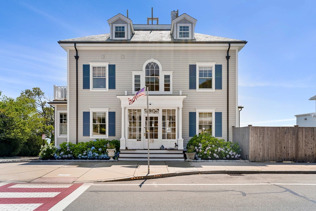79 Lothrop Street Beverly, MA 01915 - Photo 2 of 42 a front view of a house with a yard
