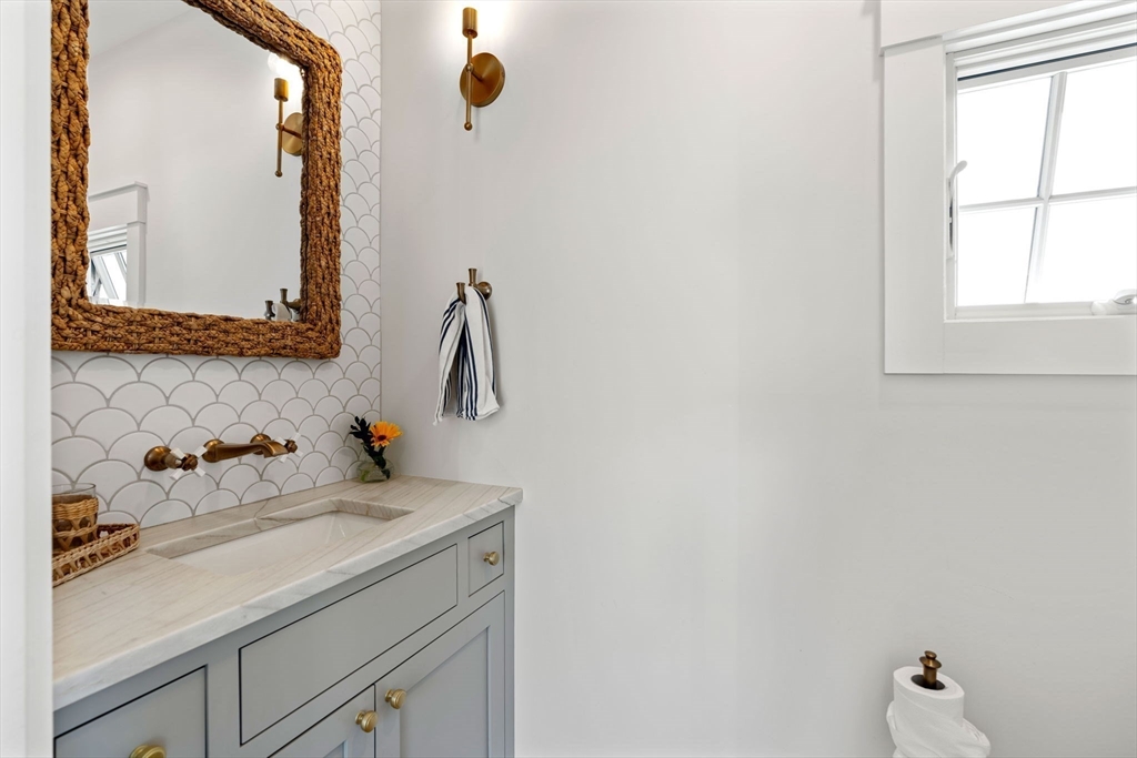 79 Lothrop Street Beverly, MA 01915 - Photo 21 of 42 a bathroom with a sink and a mirror