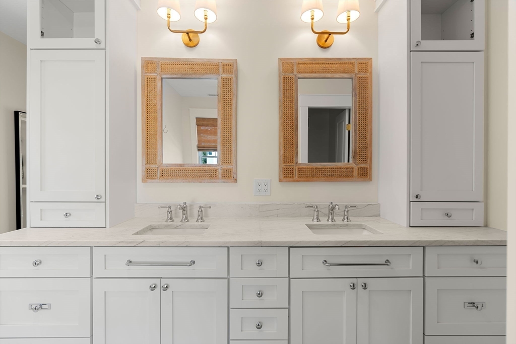 79 Lothrop Street Beverly, MA 01915 - Photo 29 of 42 a bathroom with double sink and a mirror