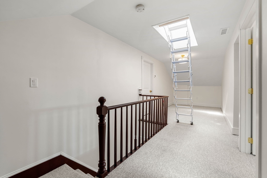 79 Lothrop Street Beverly, MA 01915 - Photo 37 of 42 a view of a hallway with windows