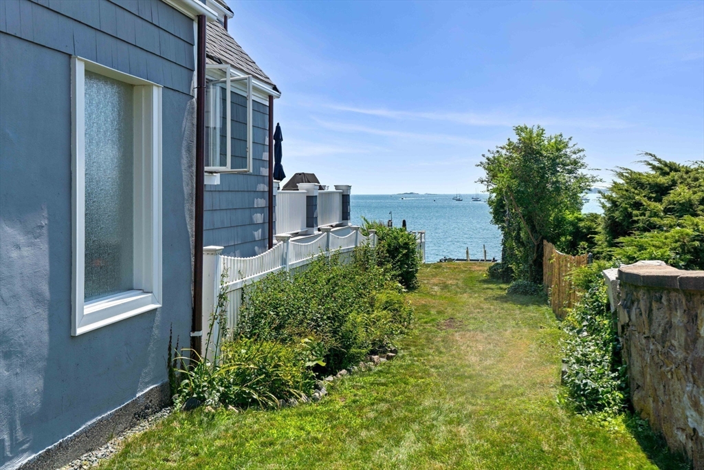 79 Lothrop Street Beverly, MA 01915 - Photo 40 of 42 a backyard of a house with lots of green space