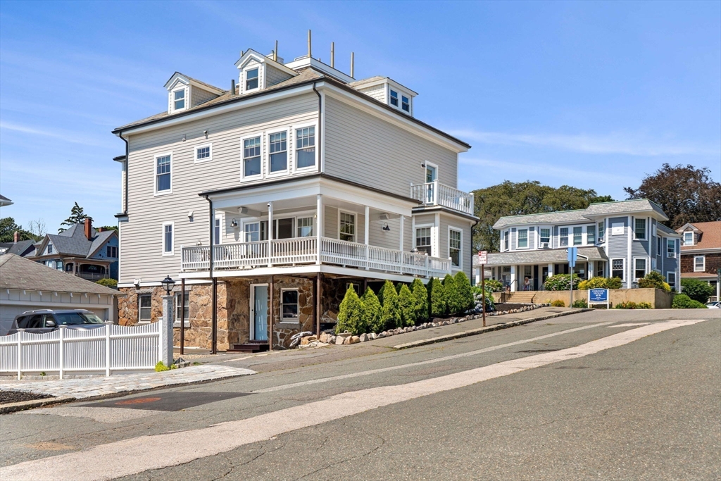 79 Lothrop Street Beverly, MA 01915 - Photo 6 of 42 a front view of a building with a street