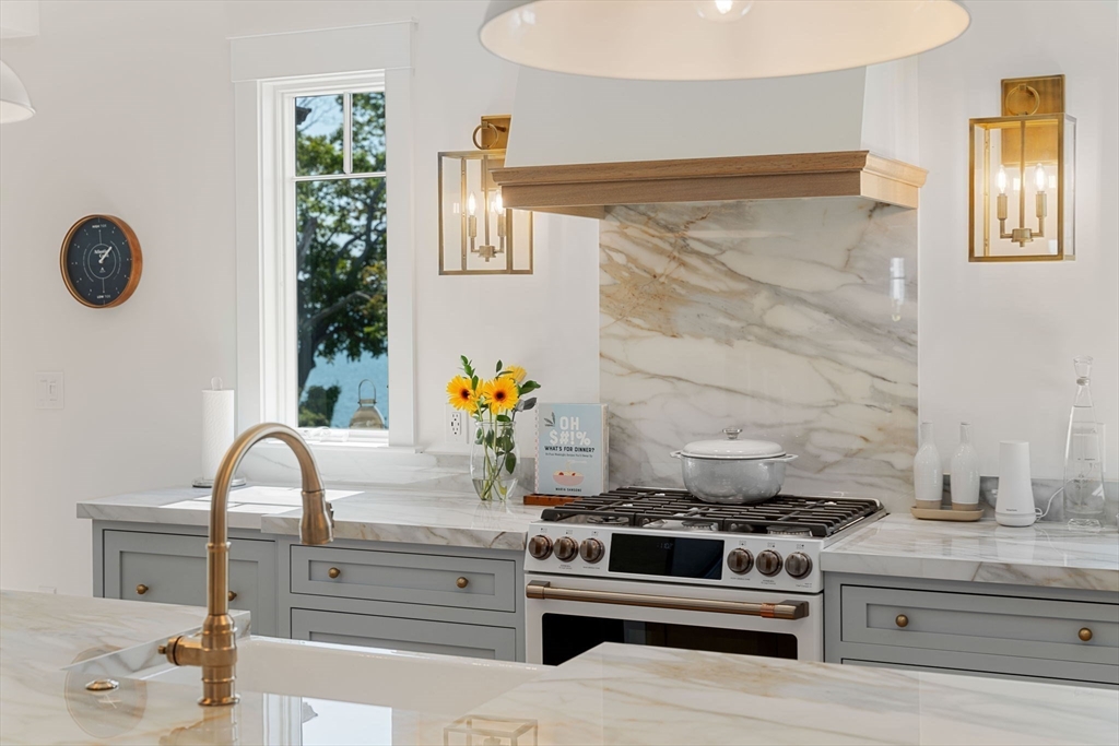 79 Lothrop Street Beverly, MA 01915 - Photo 9 of 42 a kitchen with a stove and a sink