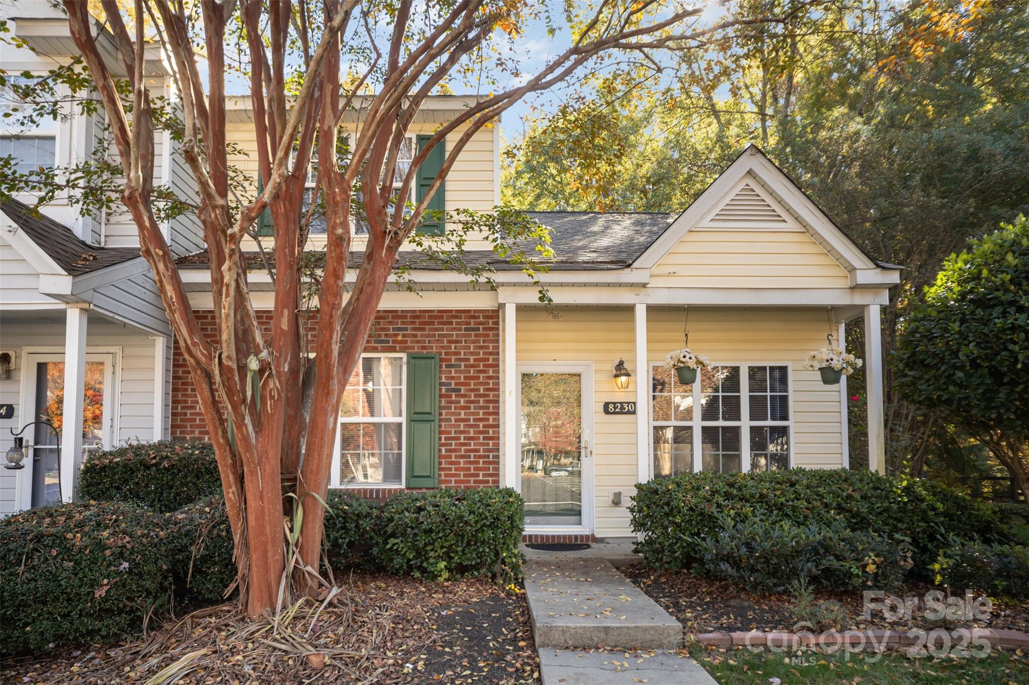 8230 Rudolph Road Charlotte, NC 28216 - Photo 13 of 38 a front view of a house with garden