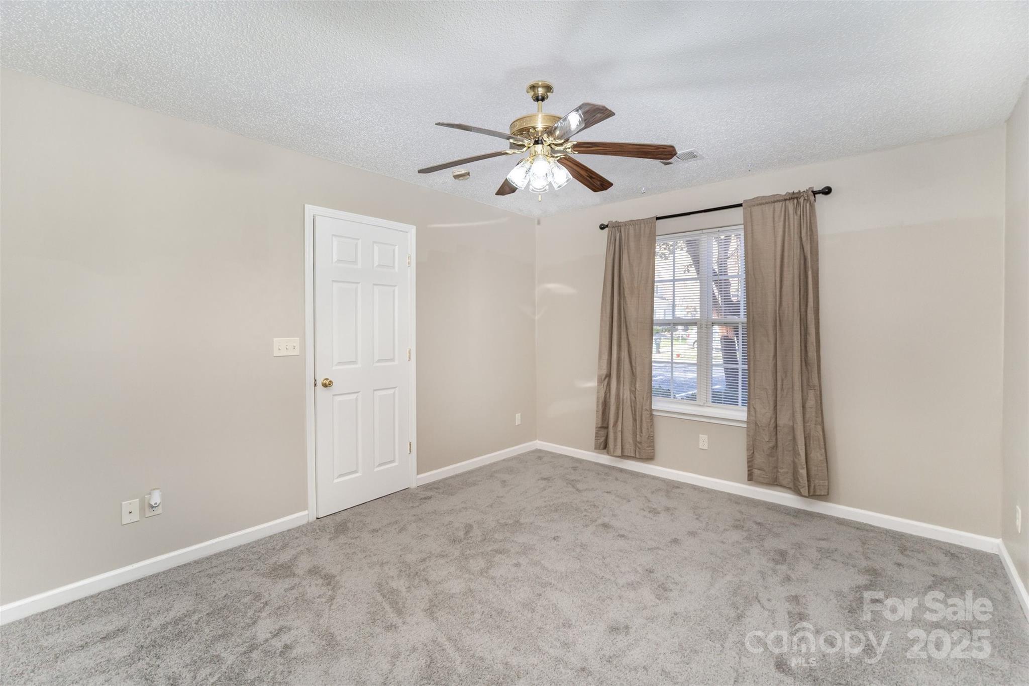 8230 Rudolph Road Charlotte, NC 28216 - Photo 26 of 38 a view of an empty room with a window