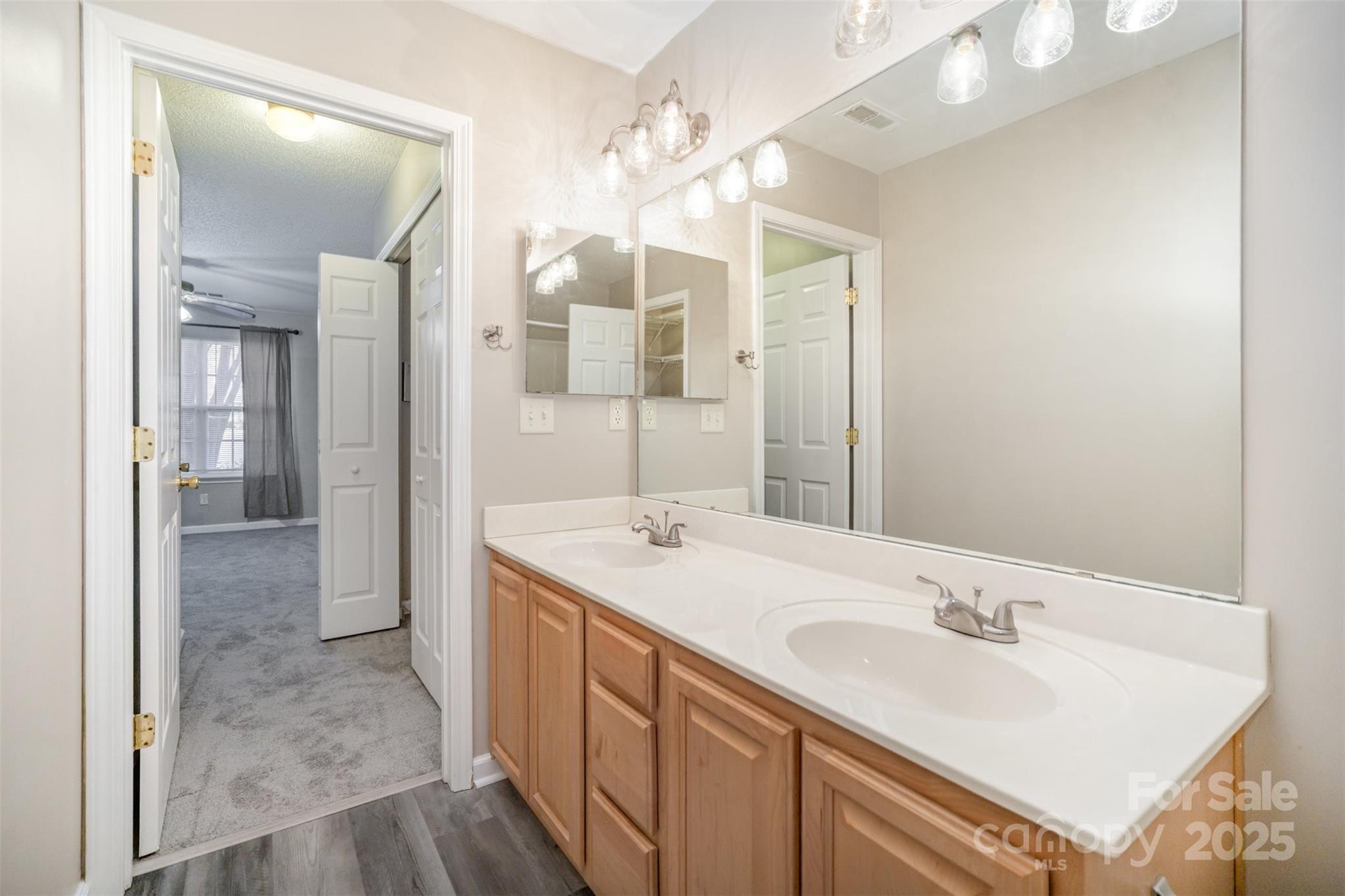 8230 Rudolph Road Charlotte, NC 28216 - Photo 27 of 38 a bathroom with a sink and a mirror