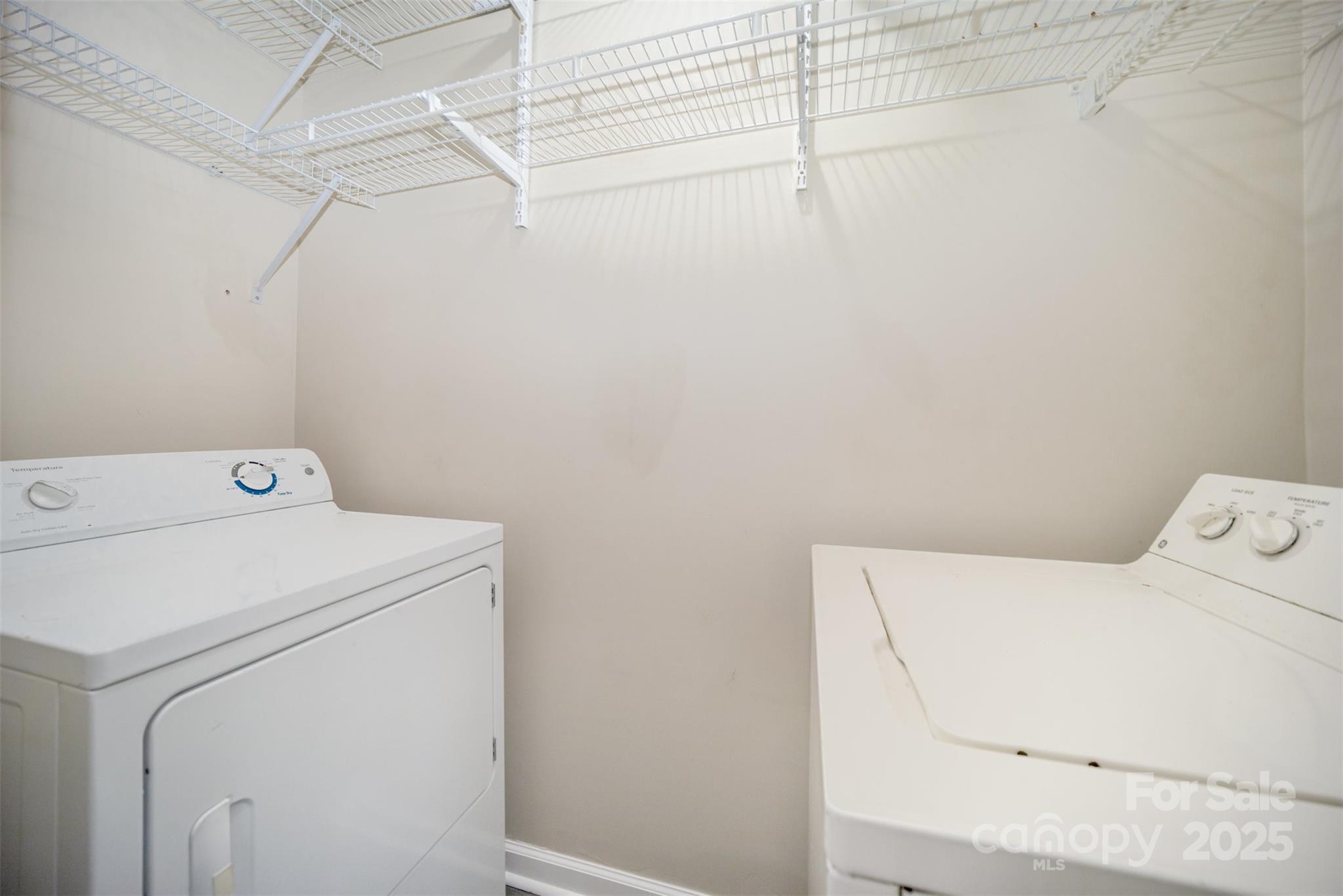8230 Rudolph Road Charlotte, NC 28216 - Photo 30 of 38 a utility room with dryer and washer