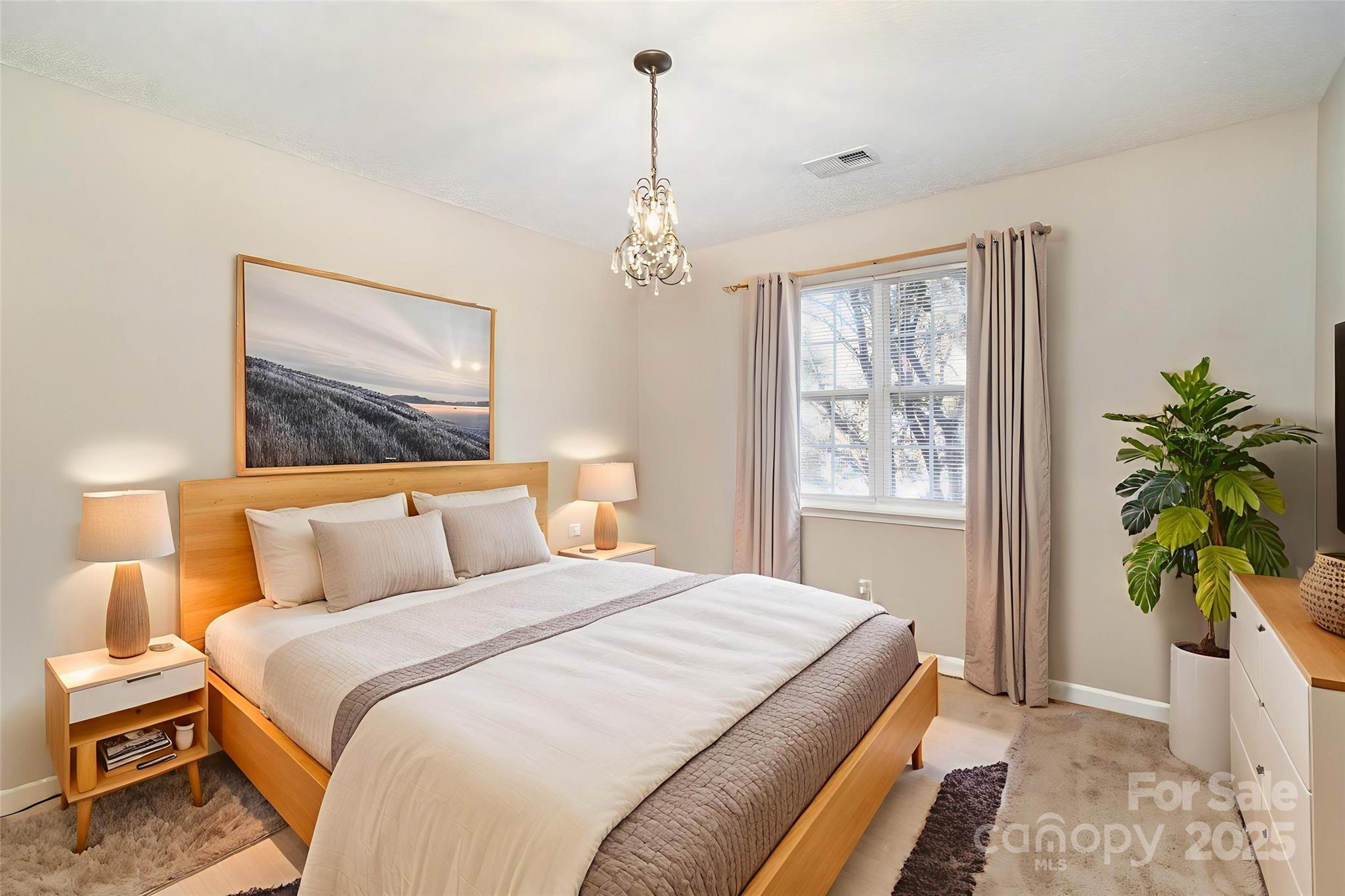 8230 Rudolph Road Charlotte, NC 28216 - Photo 7 of 38 a bedroom with a bed and a window