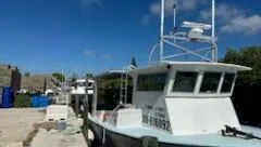 a view of a patio with dining table and chairs
