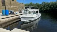 a balcony with a table and chairs