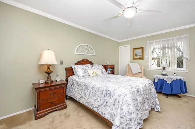 a bedroom with bed and a window