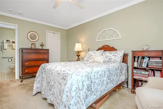 a bedroom with a bed and dresser