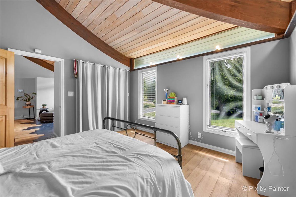 6111 Ridgeview Drive Huntley, IL 60142 - Photo 13 of 54 a bedroom with a bed and large windows