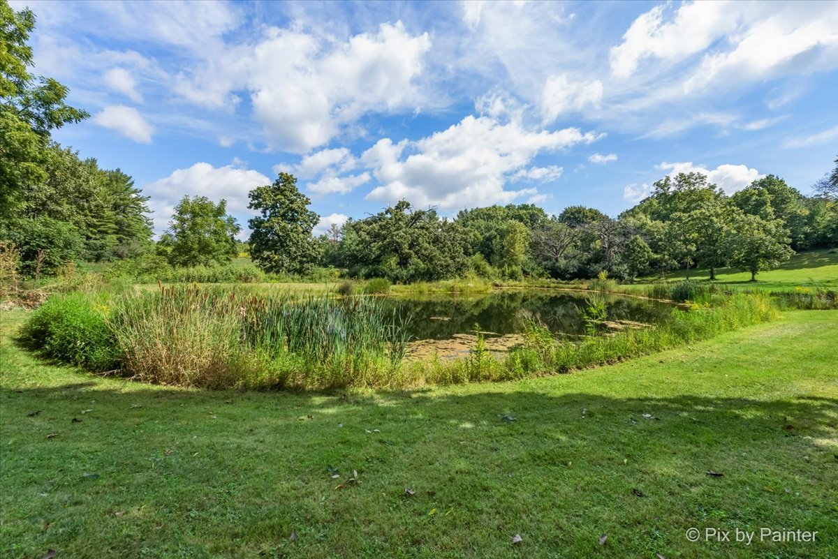 6111 Ridgeview Drive Huntley, IL 60142 - Photo 25 of 54 a view of a lake with houses in the back