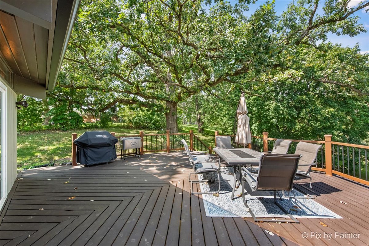 6111 Ridgeview Drive Huntley, IL 60142 - Photo 41 of 54 a view of a chairs and table on the wooden deck