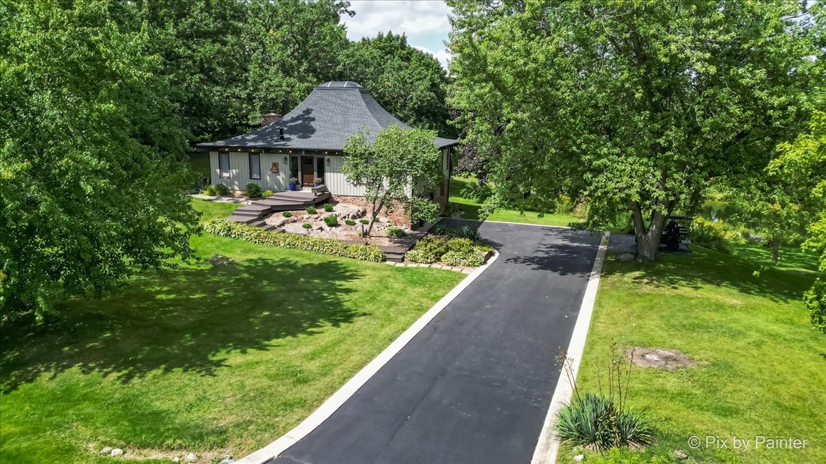 6111 Ridgeview Drive Huntley, IL 60142 - Photo 42 of 54 a front view of house with yard and green space