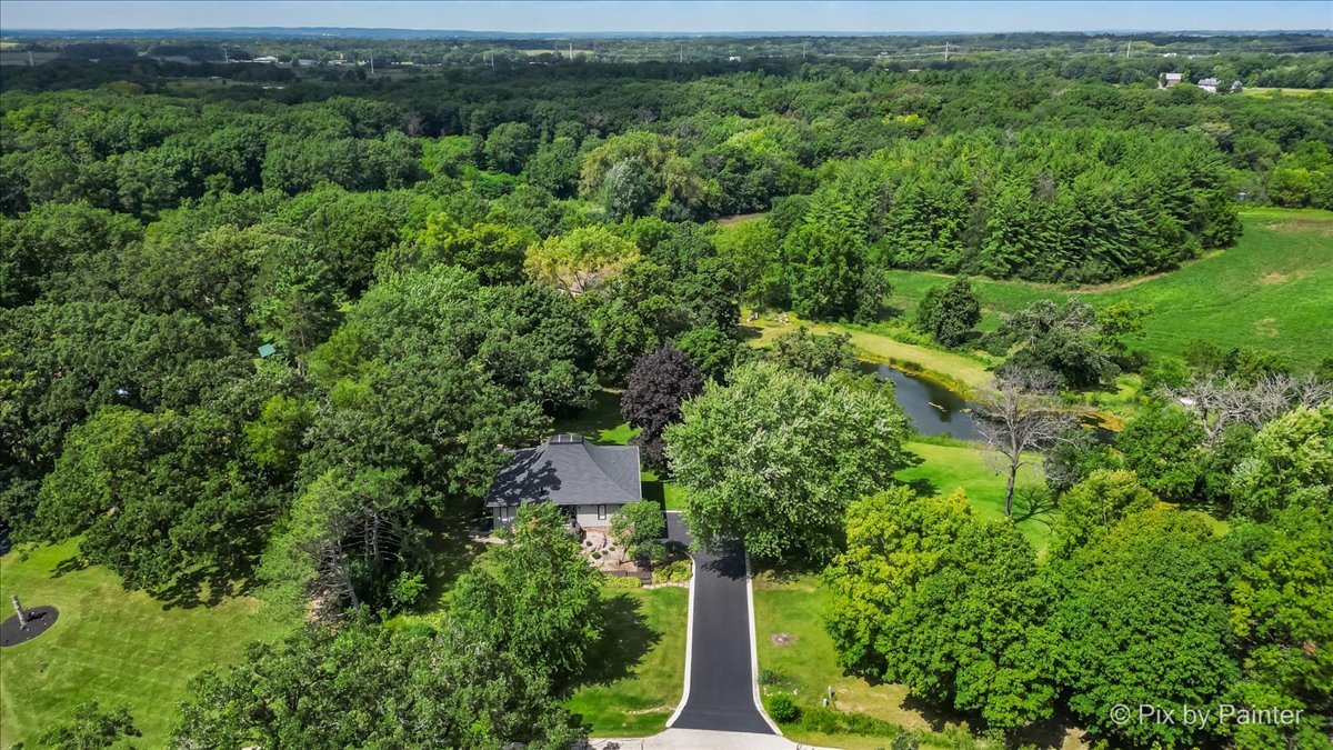 6111 Ridgeview Drive Huntley, IL 60142 - Photo 44 of 54 an aerial view of a house with a yard