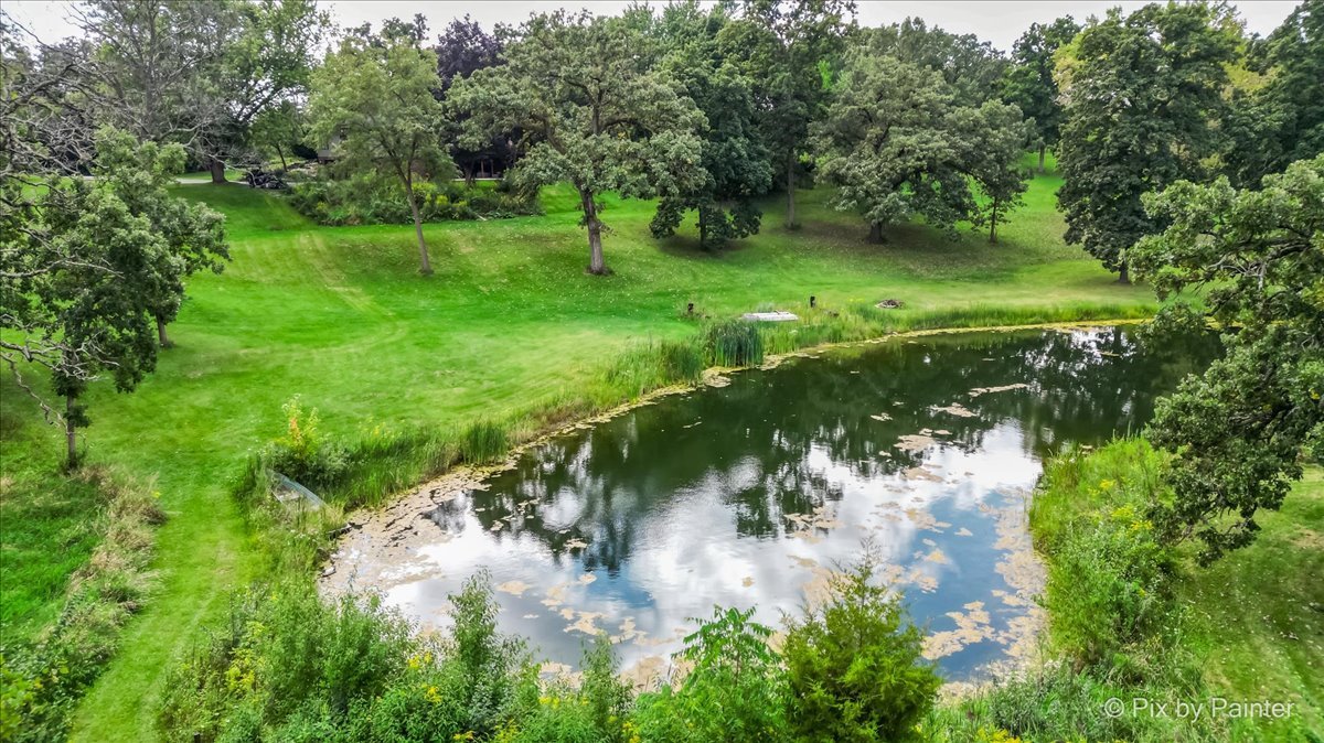 6111 Ridgeview Drive Huntley, IL 60142 - Photo 54 of 54 a view of a garden with a lake