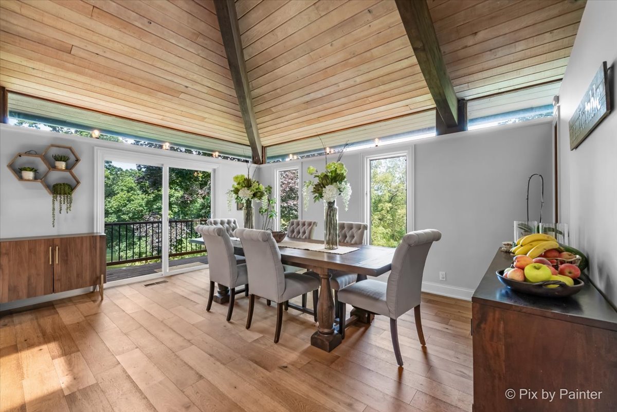 6111 Ridgeview Drive Huntley, IL 60142 - Photo 9 of 54 a view of a patio with table and chairs and wooden floor