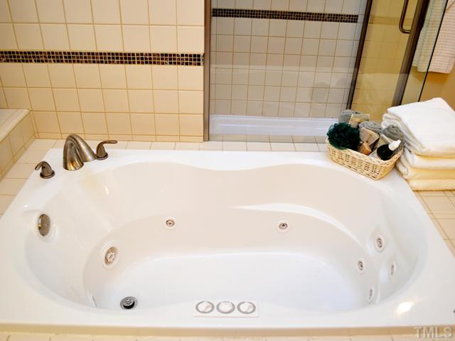 10013 Goodview Court Raleigh, NC 27613 - Photo 22 of 24 Master Jetted Tub & Tiled Shower