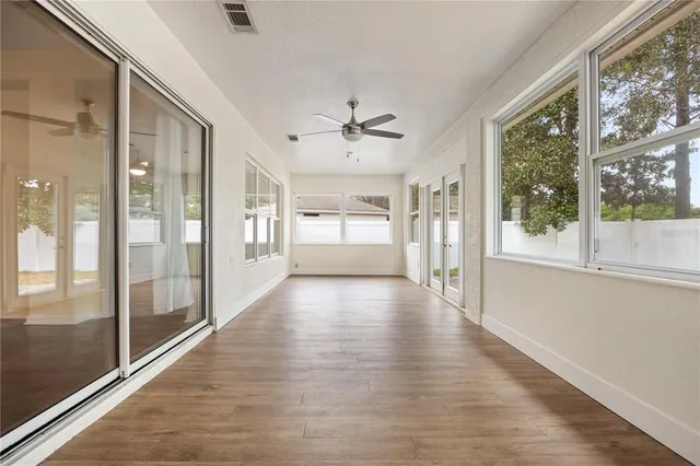 a view of an entryway with wooden floor