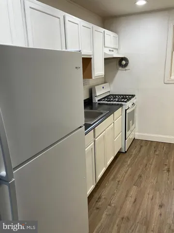 a kitchen with a stove and a microwave
